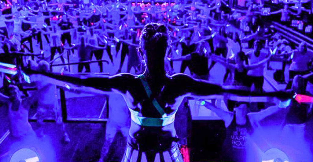 Clubbercise Instructor in front of a big crowd